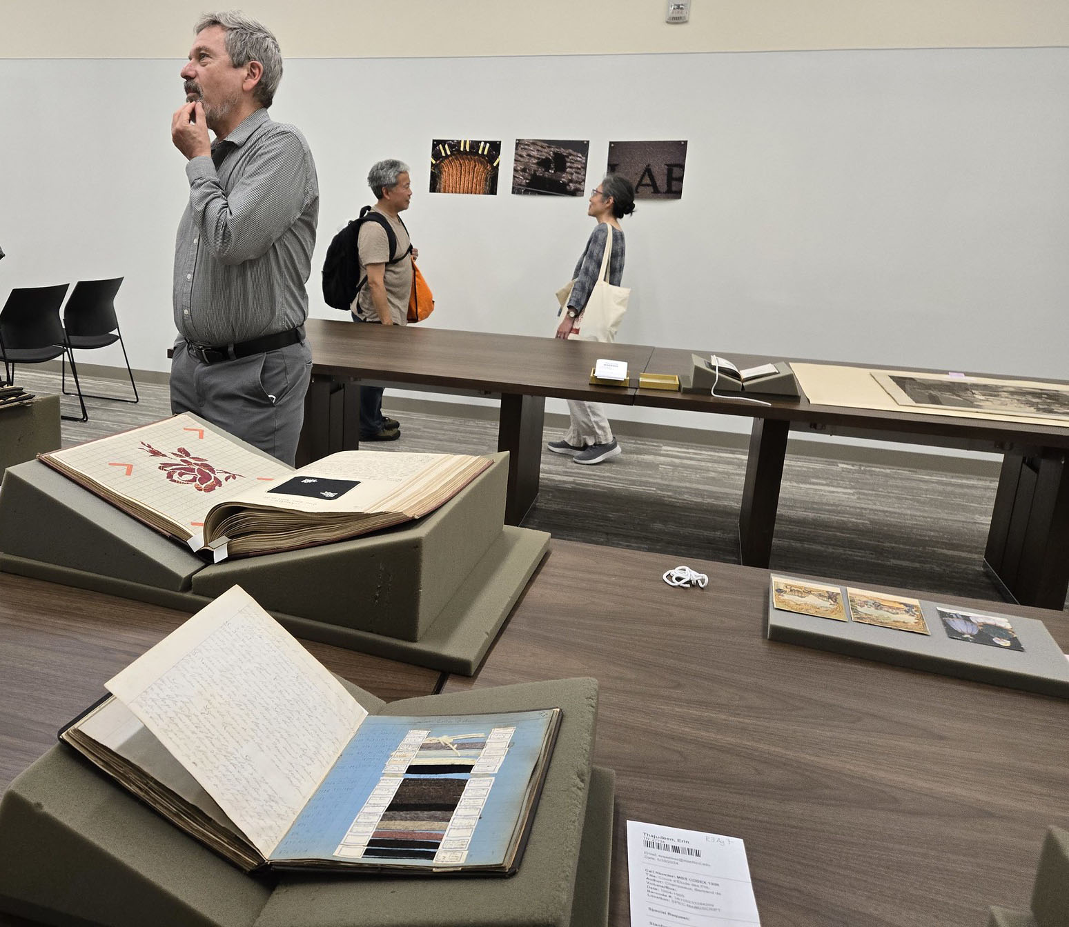 Henry Lowood and silk thread samples in the special collections room